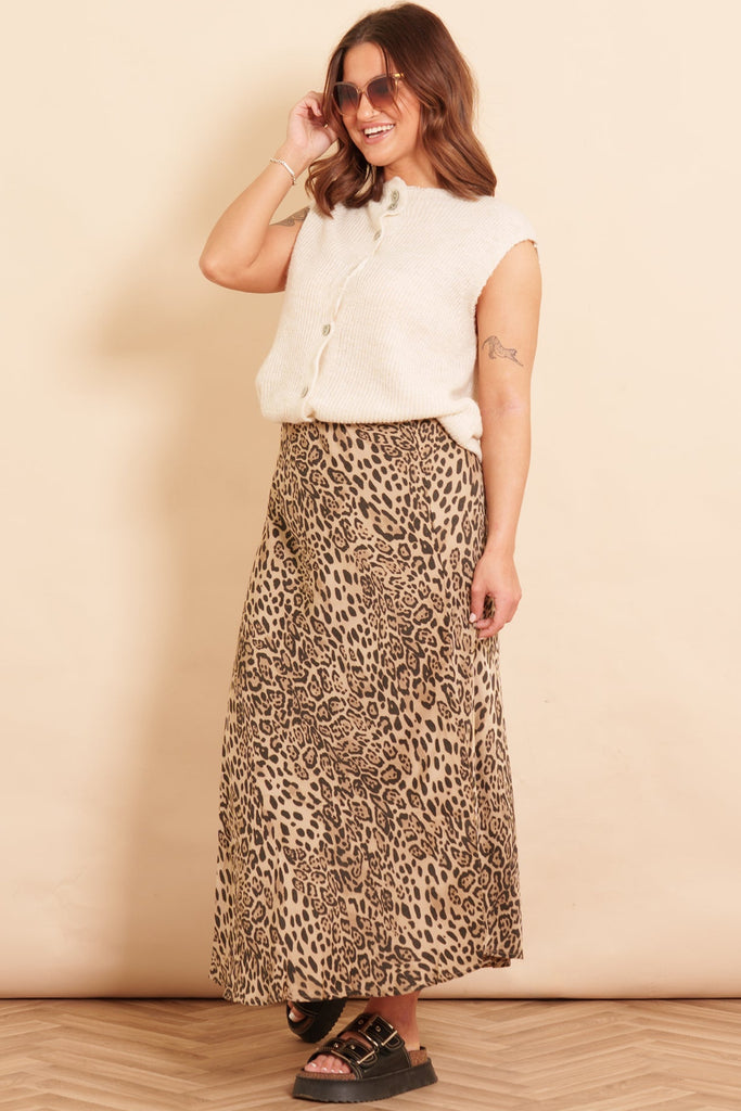 cassie-midi-slip-skirt-neutral-leopard-print-bias-cut-styled-with-cream-knitted-boston-wool-blend-vest-and-black-sandals