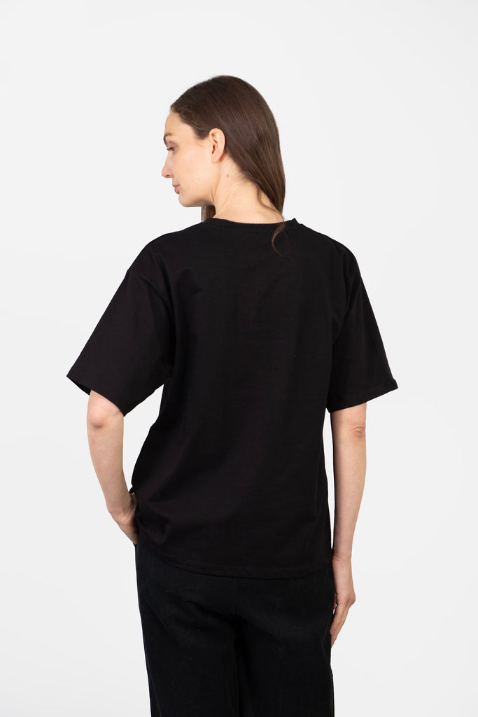 model showing the back of the t-shirt which is plain black