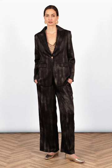 tatum-boyfriend-blazer-black-gold-metallic-brushstroke-on-model-paired-with-matching-trousers