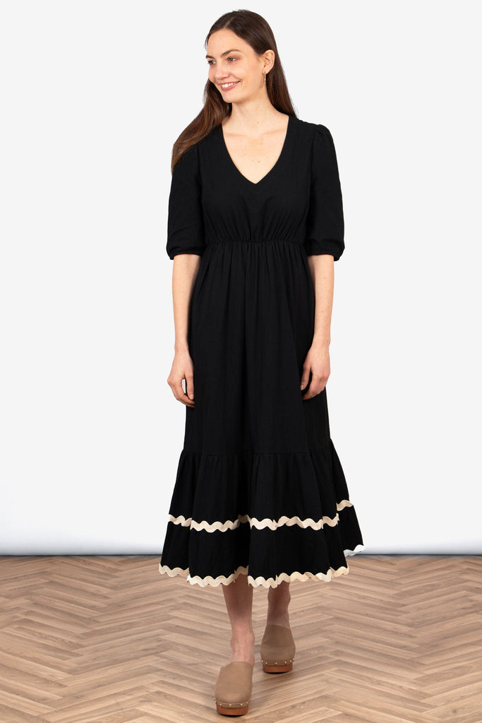 bailey-puff-sleeve-maxi-dress-black-stone-wavy-trim-on-model-front-view