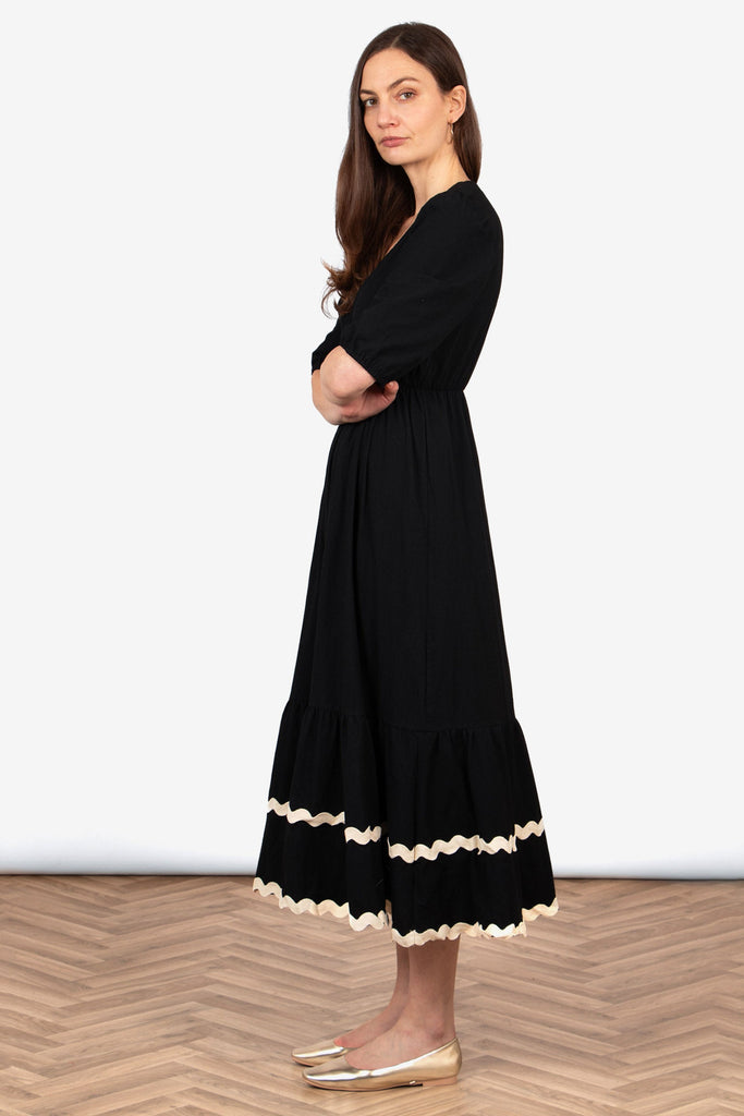 bailey-puff-sleeve-maxi-dress-black-stone-wavy-trim-side-view-tiered-hem