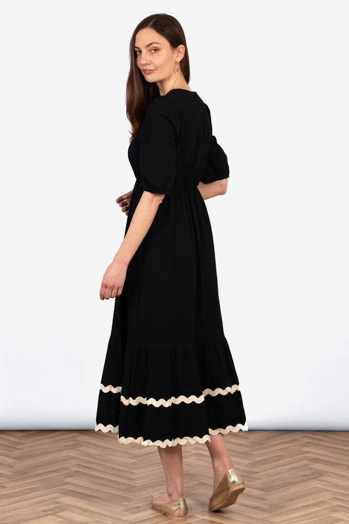 bailey-puff-sleeve-maxi-dress-black-stone-wavy-trim-rear-view