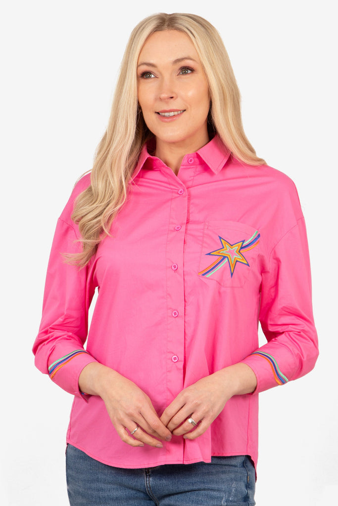 beau-long-sleeve-cotton-shirt-hot-pink-star-embroidered-on-model-front-view-rainbow-stripe-cuffs