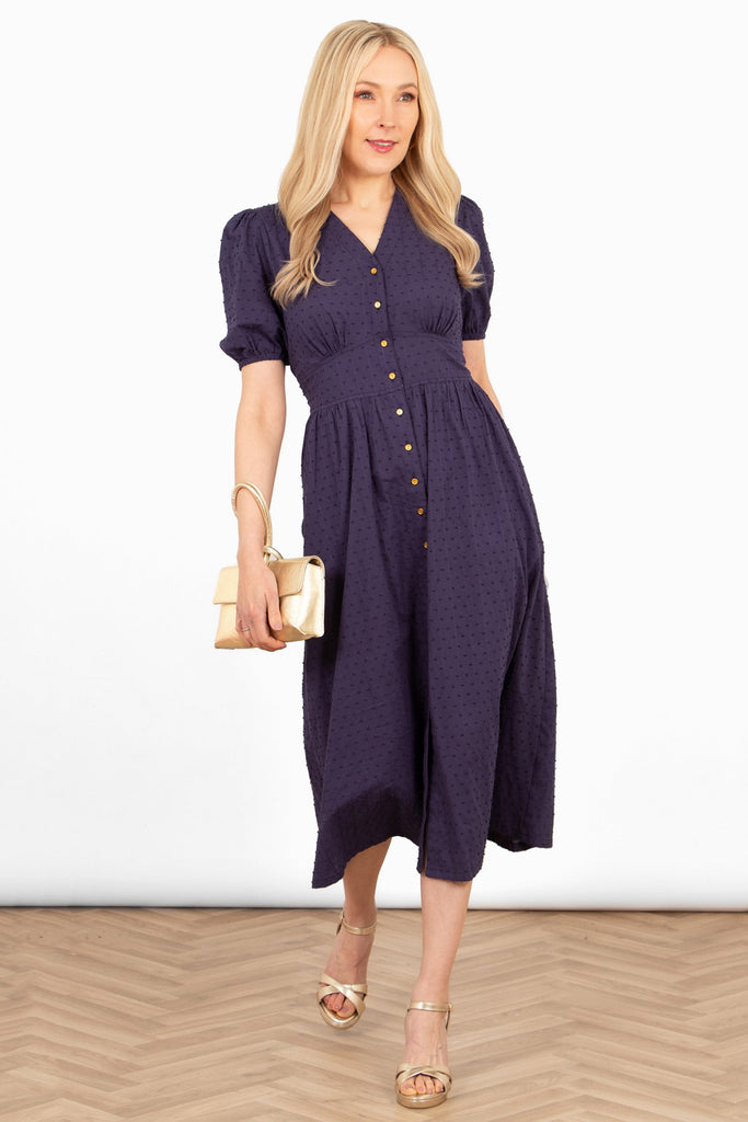 poppy-cotton-button-down-midi-tea-dress-navy-blue-dobby-styled-with-heeled-sandals-gold-clutch-bag