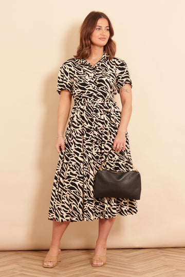 liberty-midi-shirt-dress-black-abstract-animal-print-styled-on-model-nude-sandals-black-bag