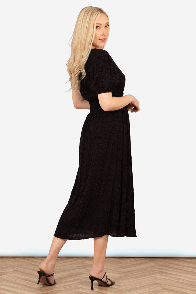 oliva-button-front-midi-tea-dress-black-asymmetric-stripe-rear-view-shirred-waist-line