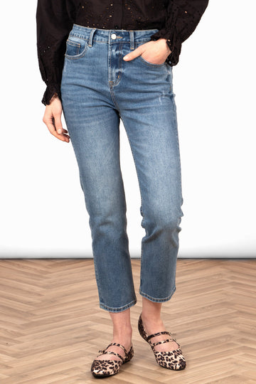 fallon-slim-leg-straight-cut-jeans-mid-wash-blue-denim-on-model-front-pockets-button-waist