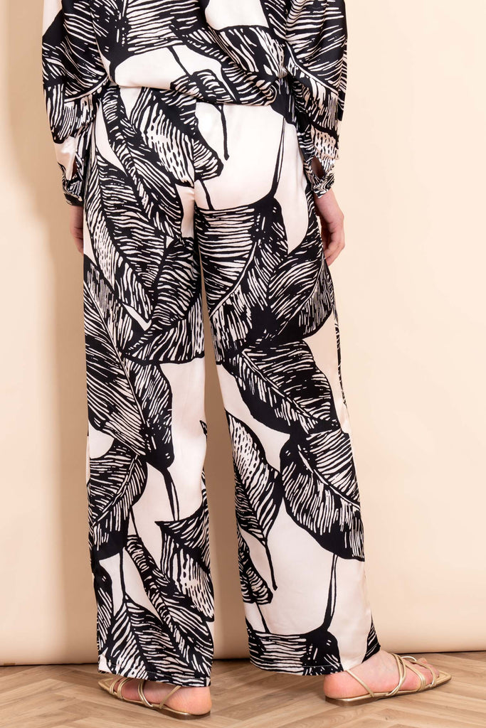 sonnie-wide-leg-trousers-black-cream-palm-leaf-rear-view-bold-print