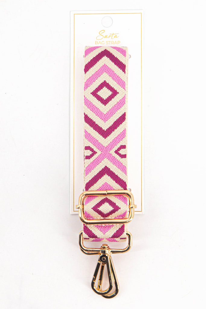 pink aztec woven bag strap in its sarta packaging