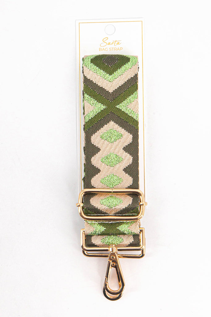 metallic green and gold aztec woven bag strap in its sarta packaging