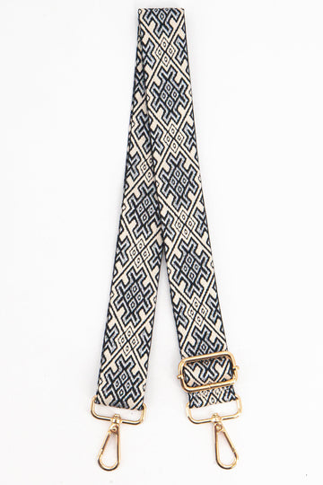 navy blue and gold jacquard pattern woven bag strap with gold hardware.