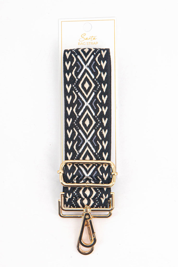  black and gold geometric woven bag strap in its sarta packaging