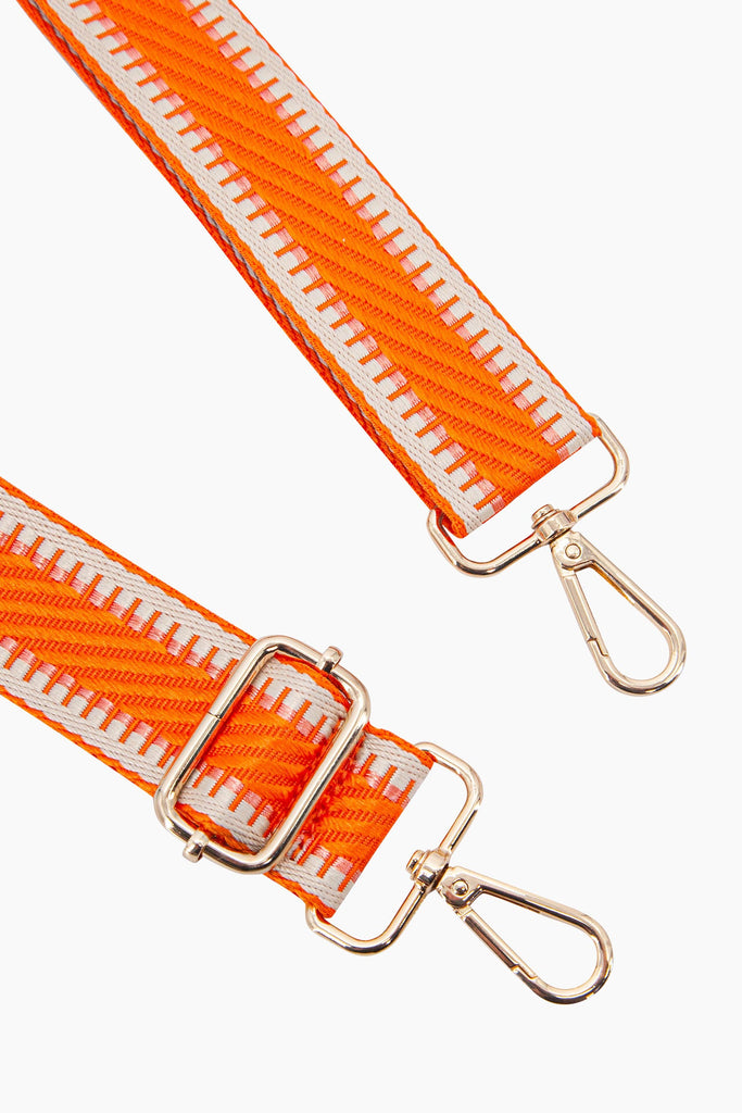 emerson-woven-bag-strap-orange-striped-trim-close-up-gold-snap-hoop-attachments