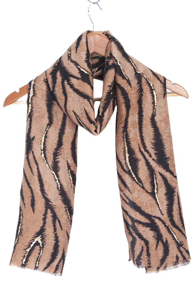 annika-brown-tiger-stripe-lightweight-scarf-draped-on-coat-hanger