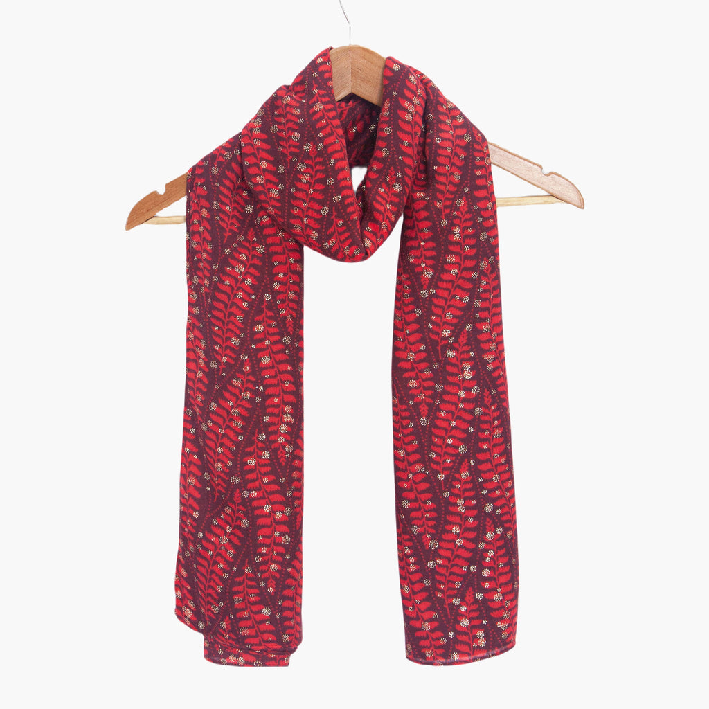 clover-red-fern-leaf-lightweight-scarf-draped-on-coat-hanger