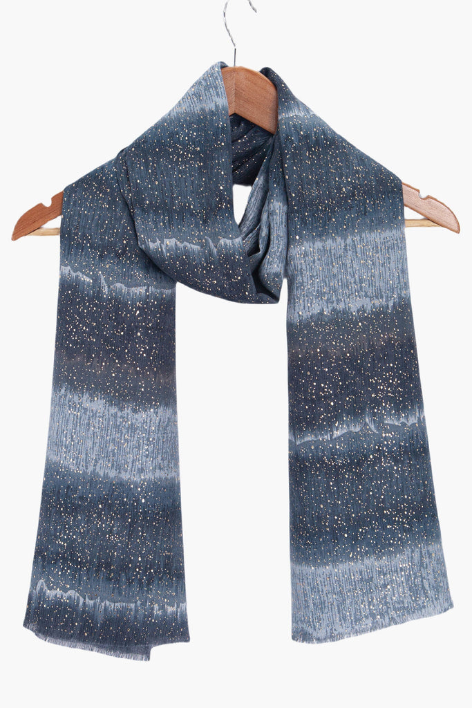tierney-grey-ombre-stripe-lightweight-scarf-draped-on-coat-hanger
