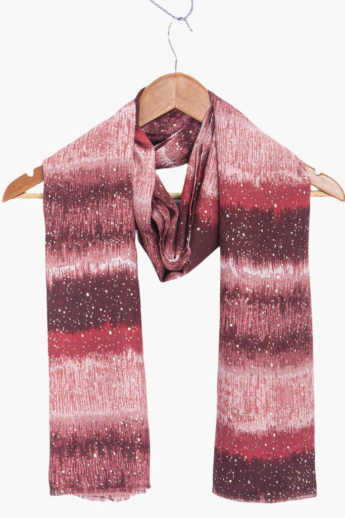 tierney-red-ombre-stripe-lightweight-scarf-draped-on-coat-hanger