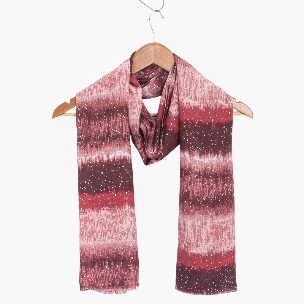 tierney-red-ombre-stripe-lightweight-scarf-draped-on-coat-hanger