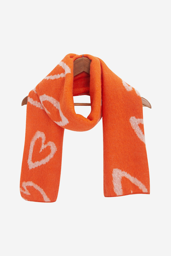 zuri-cream-orange-sketched-hearts-heavyweight-scarf-draped-coat-hanger