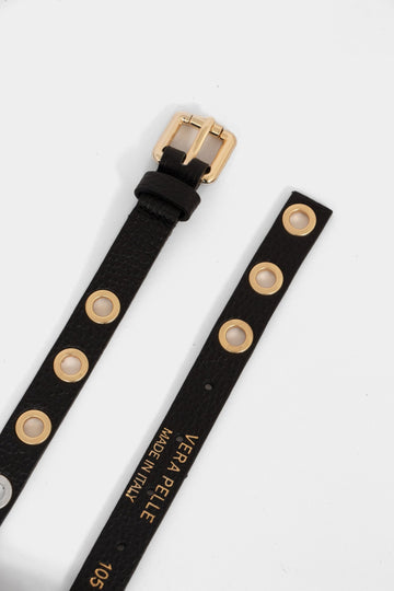 a skinny black belt with gold coloured porthole fasternings and a gold buckle. the belt is made from pebbled italian leather.