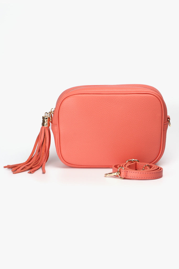 coral orange leather crossbody bag with matching detachable bag strap