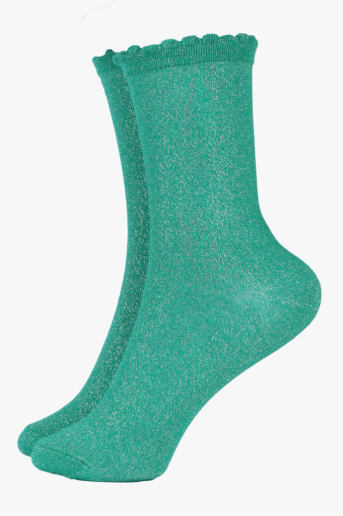 green ankle socks with a scalloped edge and an all over silver glitter sparkle