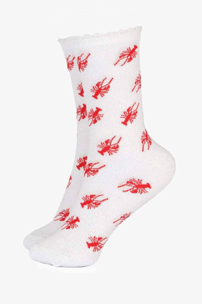 white ankle socks with an all over silver glitter sparkle and a red lobster pattern