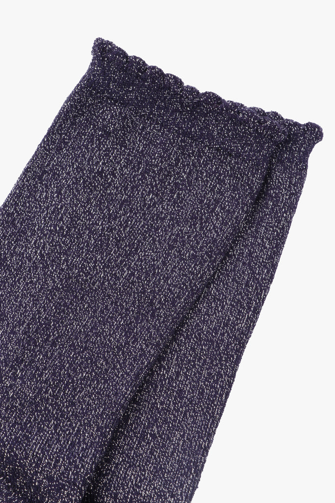 close up of the silver glitter sparkle on the scalloped edge ankle socks