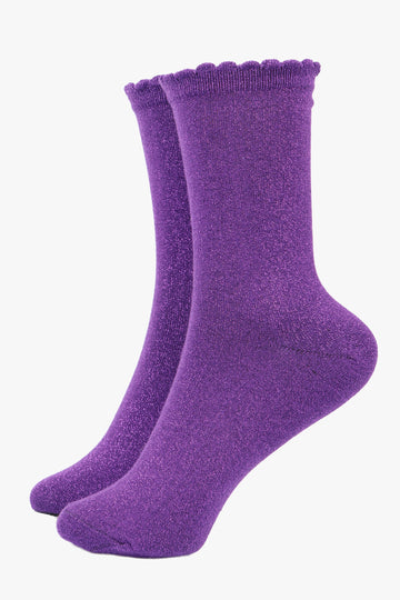 purple socks with an all over silver sparkle, the socks have scalloped cuffs