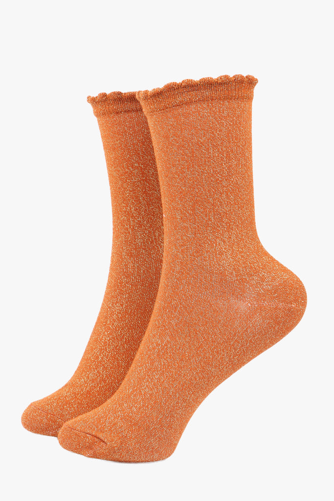 orange ankle socks with scalloped cuff and an all over gold glitter sparkle