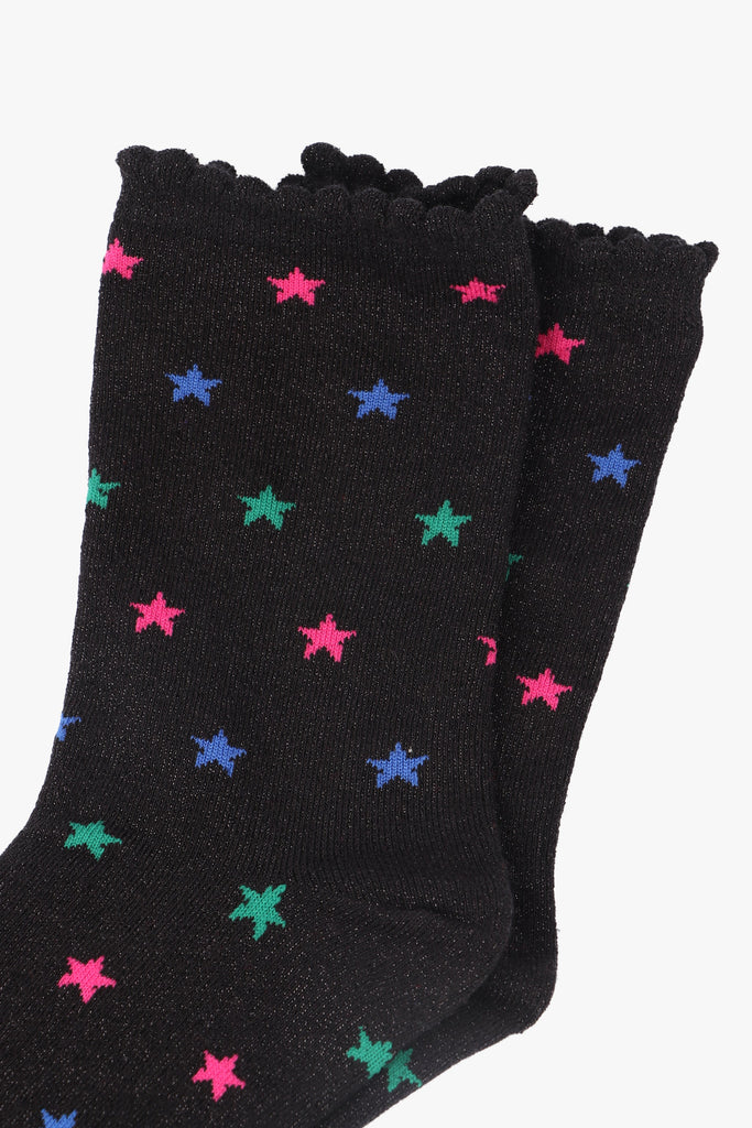 close up of the silver glitter sparkle on the star print socks
