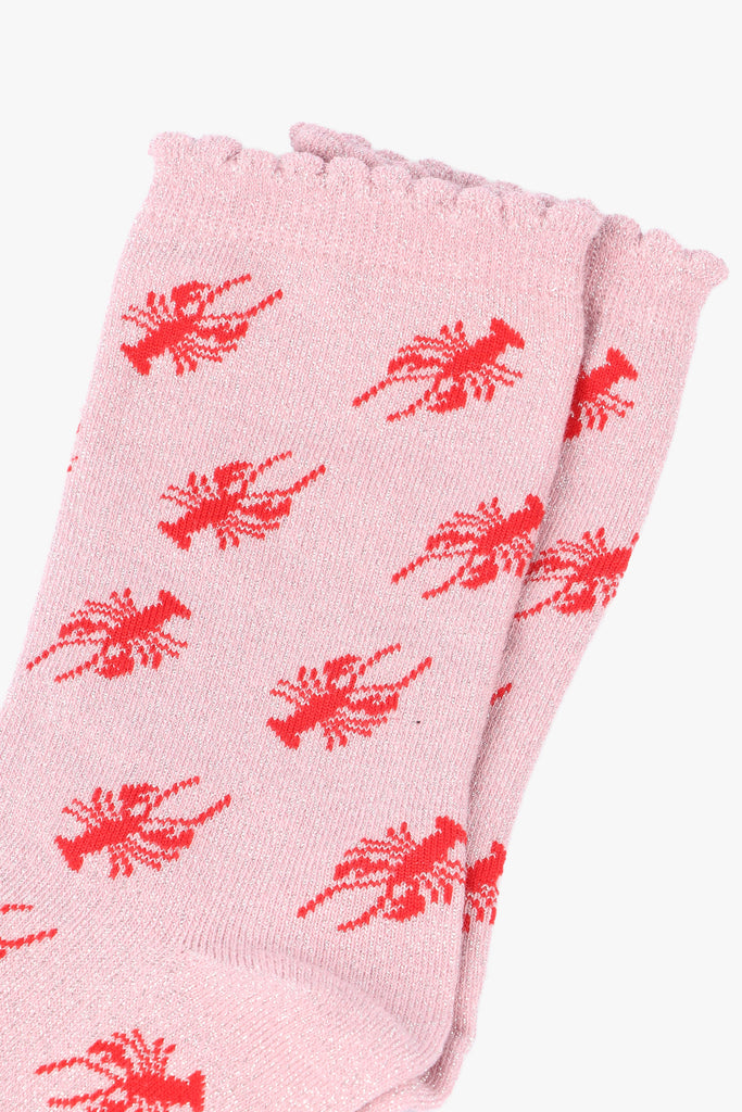 close up of the red lobster pattern on the sparkly ankle socks