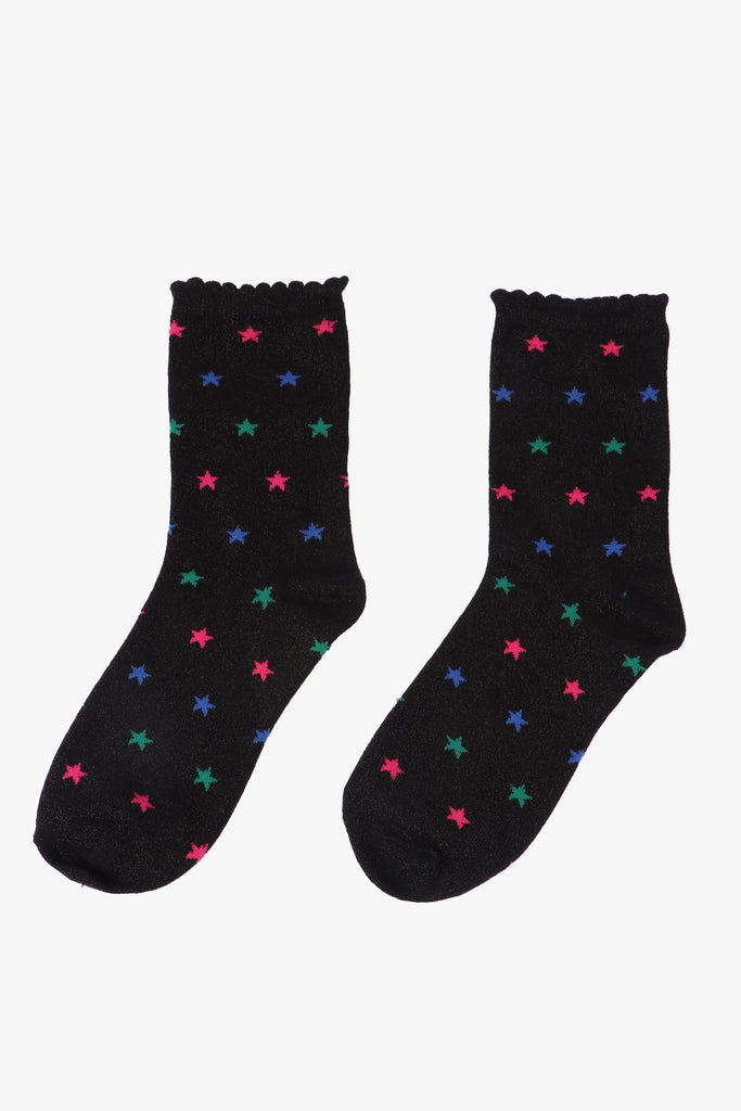 black socks with a green, blue and pink star pattern and all over glitter sparkle