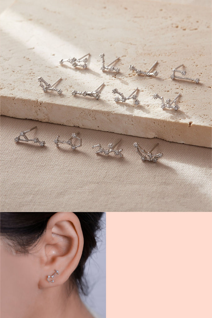 constellation stud earrings in the shapes of all of the zodiac constellations, made from sterling silver and cubic zirconia