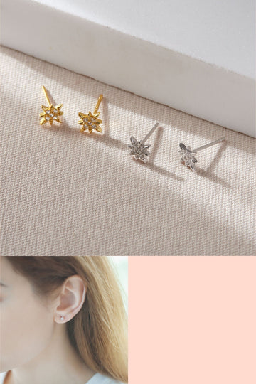 two pairs of octagonal eight point start studs earrings with sparkly cubic zirconia, one pair is silver and the other pair is gold plated sterling silver