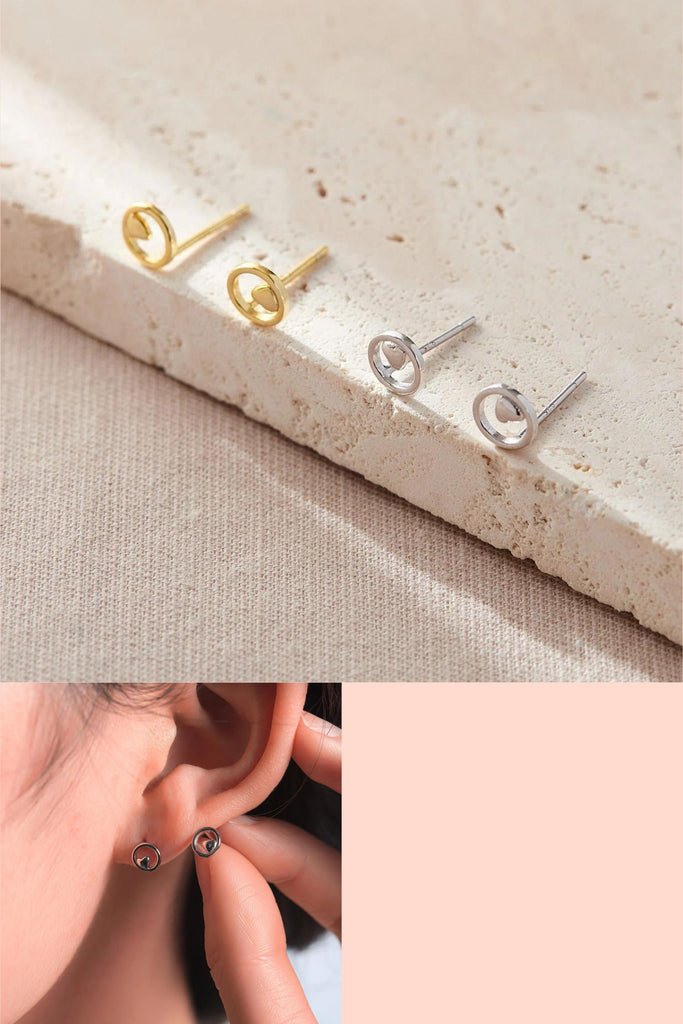 sterling silver circle studs with a dainty love heart in the middle of the circle, available in silver and gold 