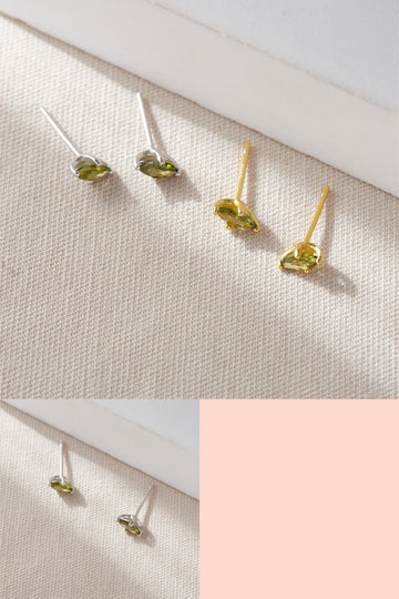 sterling silver dainty stud earrings with an oval shaped cz crystal in olive green mounted on s925 sterling silver studs, available as silver or gold plated sterling silver