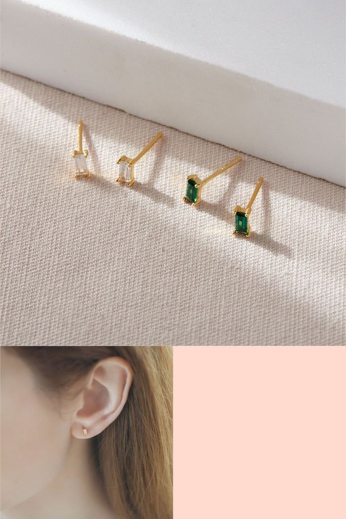 gold plated sterling silver stud earrings with rectangular baguette cubic zirconia crystals in a choice of white or green, the studs are dainty and have butterfly backs