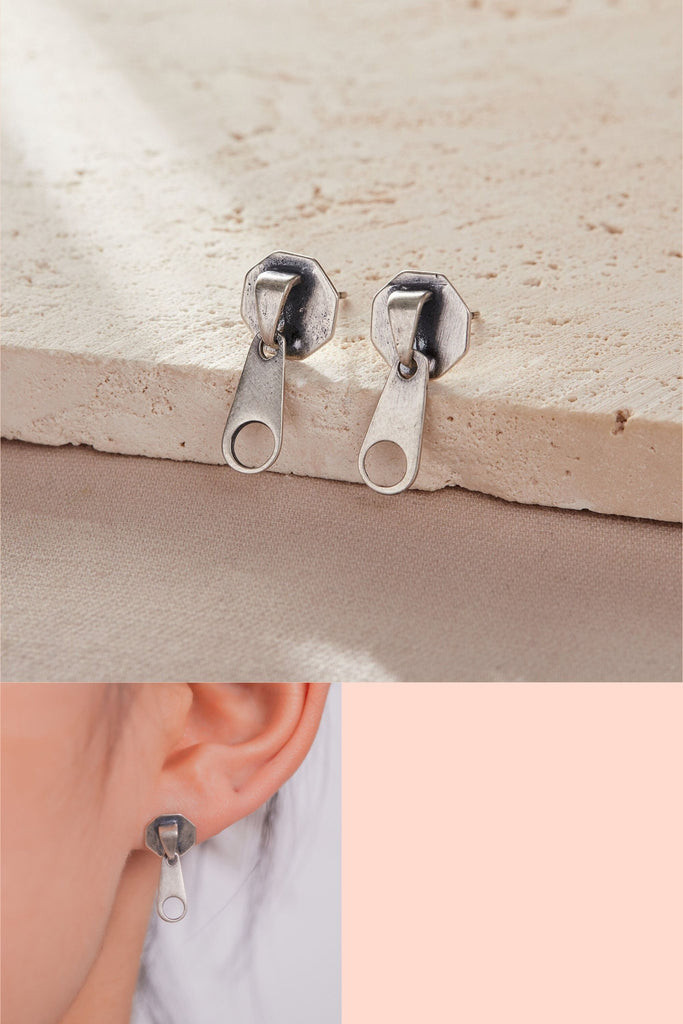 sterling silver stud earrings designed to look like a zipper 