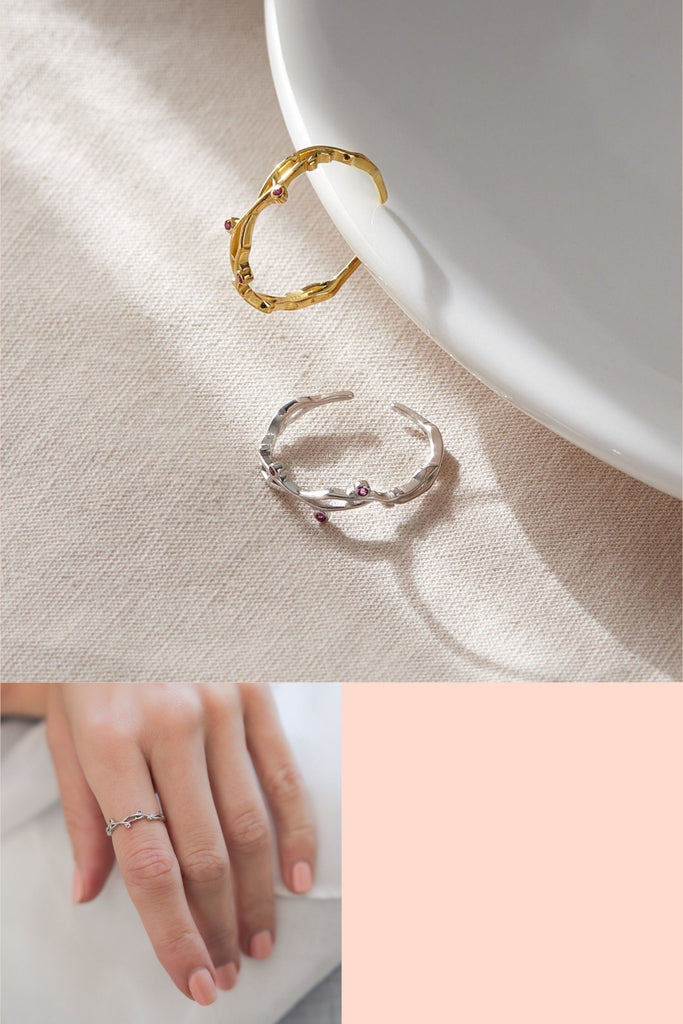 sterling silver and gold plated sterling silver open rings, designed to look like intertwined tree branches, with pink cz accents