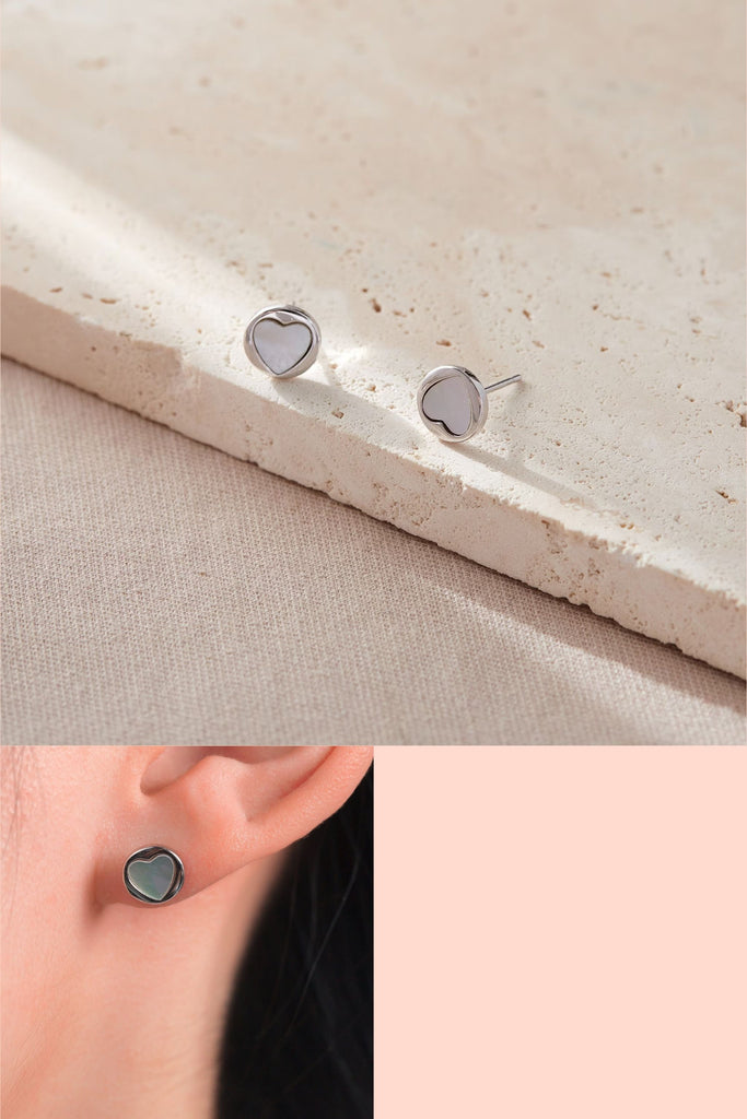 round stud earrings with a mother of pearl heart shaped centre