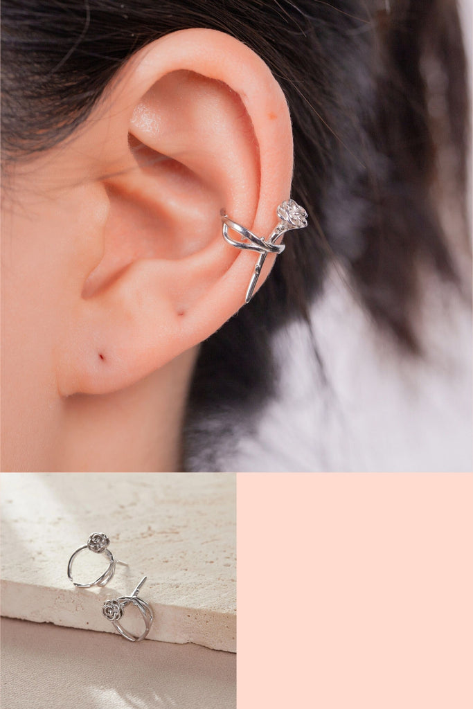 model wearing a sterling silver clip on ear cuff earring, the cuff features a vintage style rose and stem