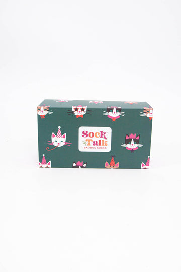 green sock gift box with a pattern of cute cats wearing party hats