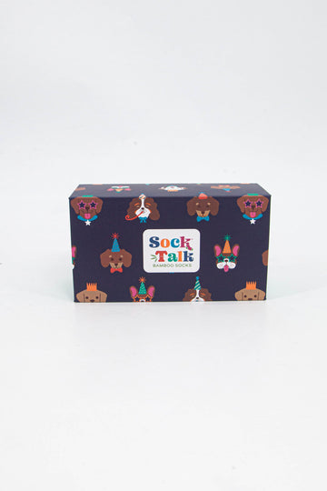 navy blue sock gift box with an all over pattern of colourful dogs wearing party hats and glasses