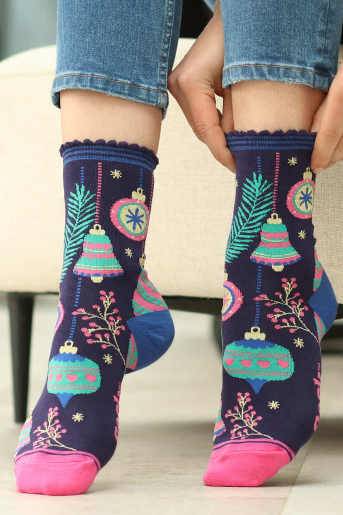 christmas bauble socks worn by a model