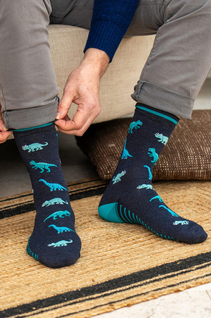 mens-bamboo-socks-navy-blue-dinosaurs-worn-by-model