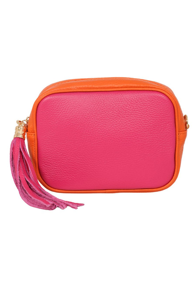 close up of the pink and orange pebbled leather crossbody camera bag