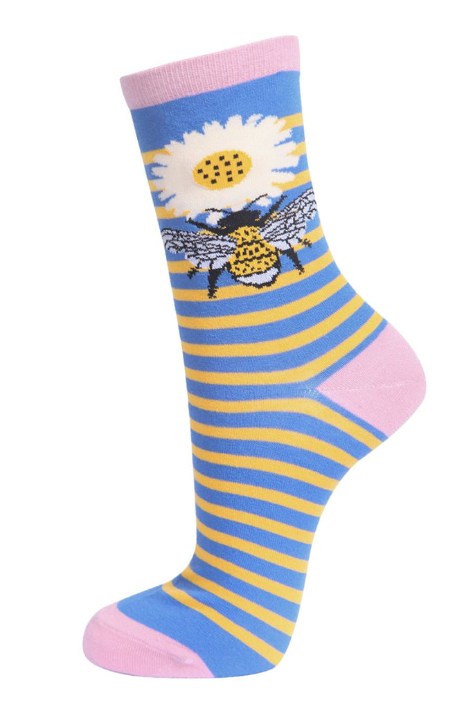 yellow and blue striped socks with a large bee and daisy flower on the ankle and pink heel, toe and cuff