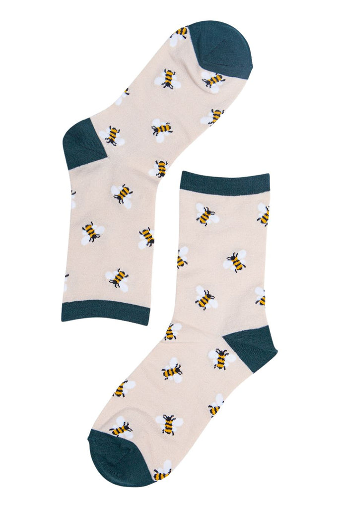cream and green bee socks with an all over pattern of bumblebees