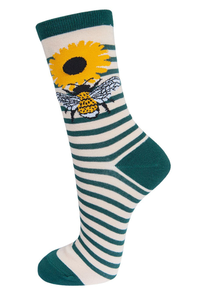 cream and green striped socks with a large bee and daisy flower on the ankle